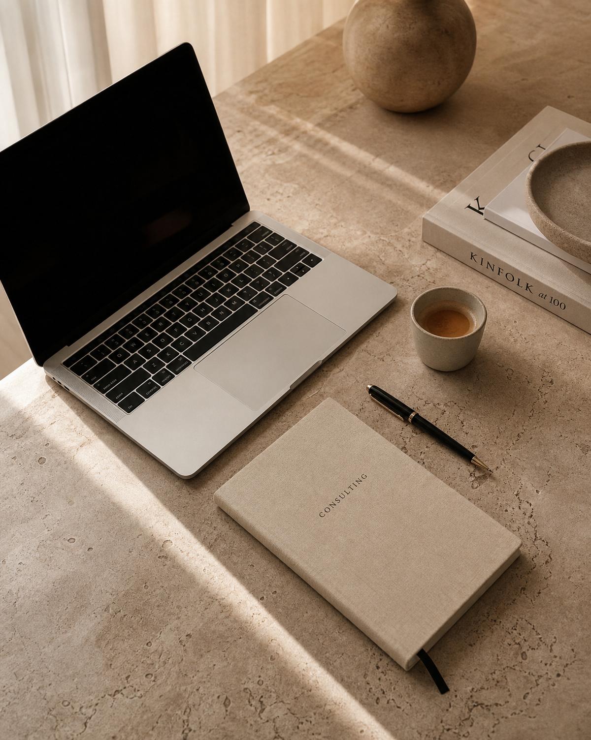 Minimal consulting workspace, laptop and notebook